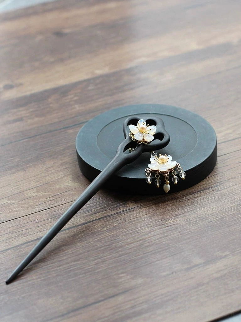 Elegant Liuying Hanfu hair accessory with black wooden hair stick and white floral pearl tassel ornament on display tray