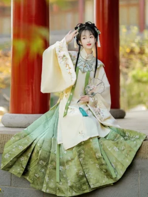 Green floral Ming Dynasty Hanfu set with ivory embroidered robe cloud collar and gradient mamian skirt in pavilion setting