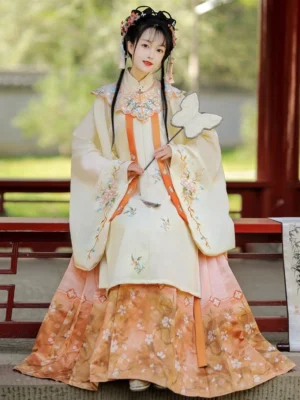 Orange floral Ming Dynasty Hanfu embroidered ivory robe cloud collar and orange horse-face skirt full front view