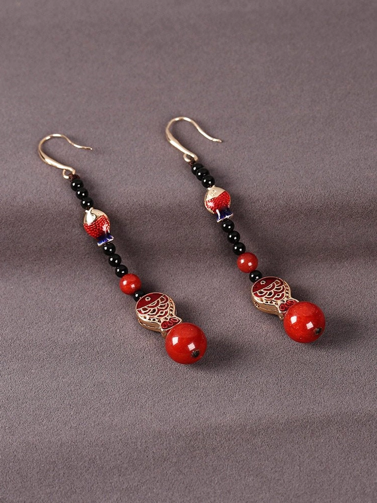Pair of long dangling koi fish earrings with gold hooks black beads layered chains and round red pendant beads