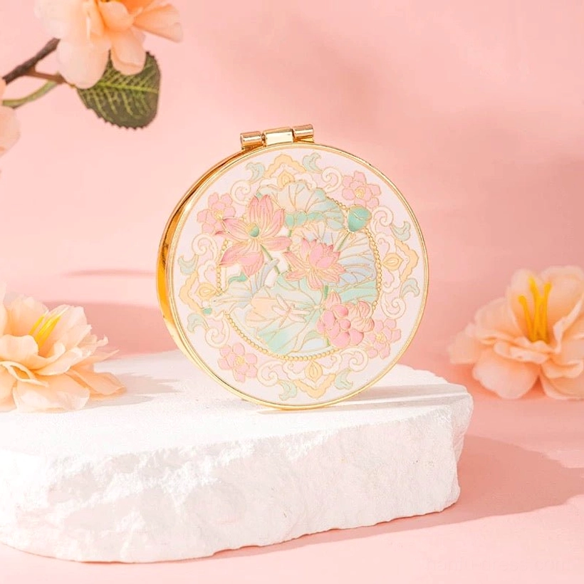 Lotus Chinese folding pocket mirror with pastel pink flowers, delicate cloud border, round gold-tone frame, and traditional enamel-inspired decoration