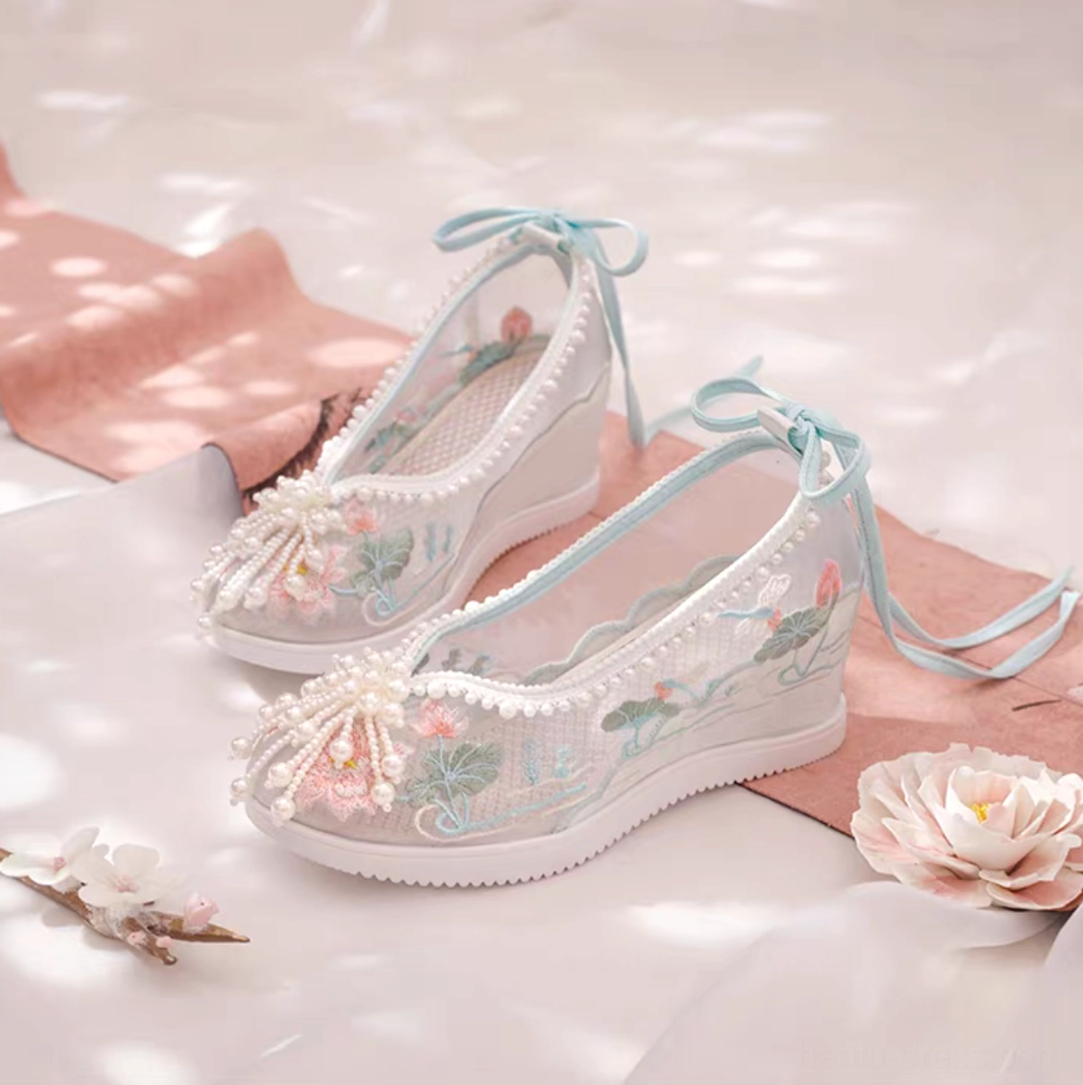 Lotus embroidered Hanfu wedge shoes with sheer mesh uppers, pearl trim, blue ankle ribbons and beaded tassel toe decoration