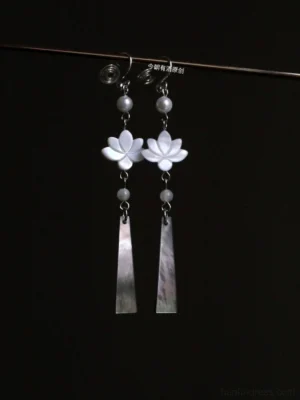 Lotus shell and pearl Hanfu drop Chinese earrings with gray beads and long mother-of-pearl pendants on black background