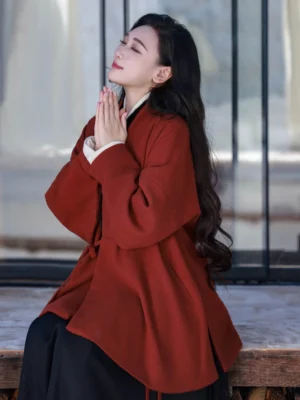 Burgundy Ming Dynasty Hanfu style cross-collar jacket with wide dropped sleeves layered over ivory winged sleeve inner top