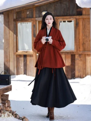 Love Letter Ming Dynasty Hanfu full set with burgundy Chinese jacket ivory winged sleeve top and black pleated wrap skirt in snowy outdoor setting
