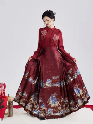 Three-quarter rear view of wine red Lunar Dragon Ming style hanfu with flowing mamianqun horse face skirt and blue gold landscape-inspired skirt decoration
