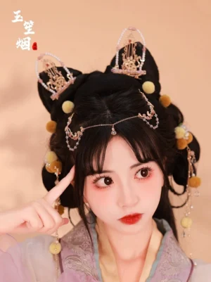 Lunar Moon Hanfu hair accessory set worn with traditional Hanfu, featuring yellow pom-poms, pearl tassels, gold-tone ornaments and forehead chain