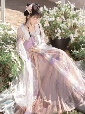 Luo Shen Wei Jin Dynasty Qiyao Ruqun Hanfu model sitting in a daisy garden wearing a sheer white outer robe, floral embroidered pastel skirt, golden waist sash, and traditional Chinese hair ornaments