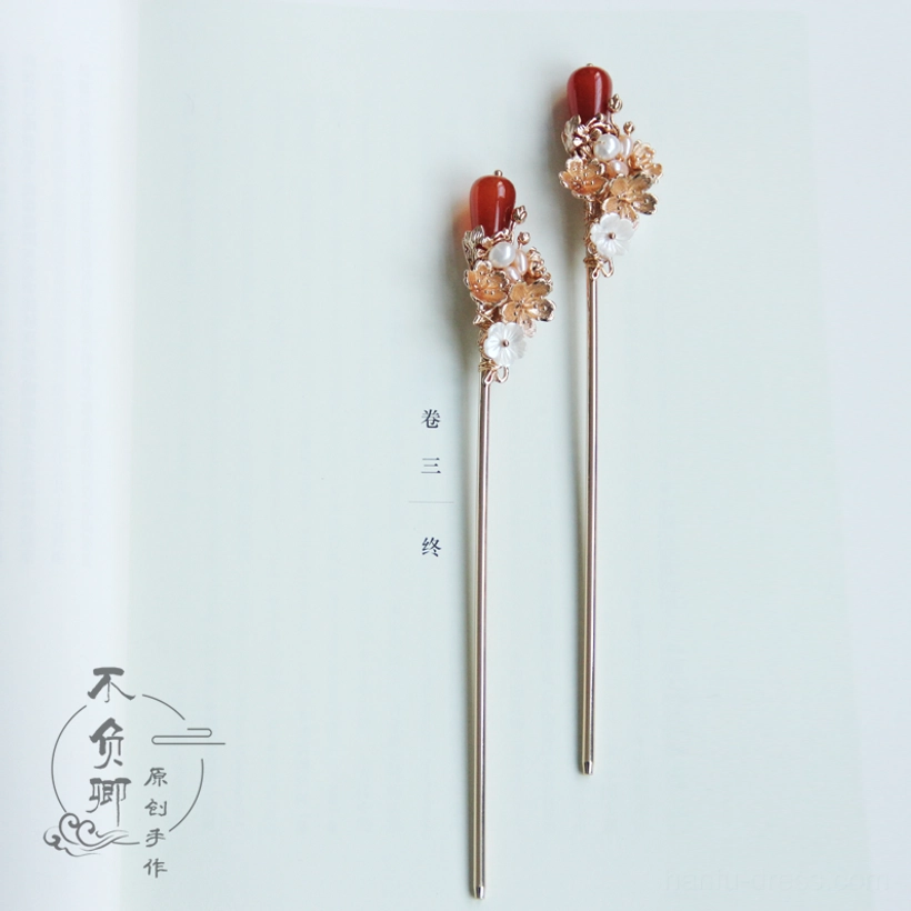 Pair of Hanfu Chinese hair stick accessories featuring slim metal pins, red agate-style drops, gold flowers, white accents, and pearl details