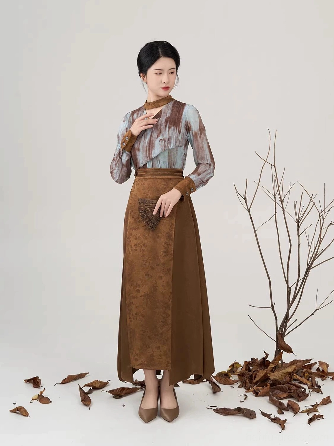 Luotong Pass Hanfu inspired full set showing stand collar cutout top and elegant textured brown asymmetric skirt