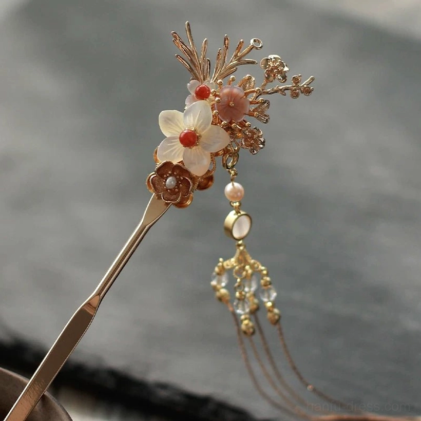 Luxury floral tassel Chinese hair stick with intricate gold branches, white and pink blossoms, layered crystal beads, and pearl pendant details