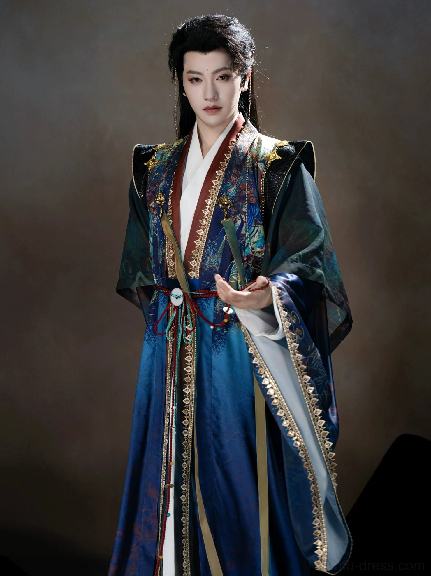 Three-quarter upper-body view of a male Dunhuang fantasy Hanfu costume with shoulder ornaments, layered cross-collar front placket, blue fabric, and elegant ancient Chinese styling