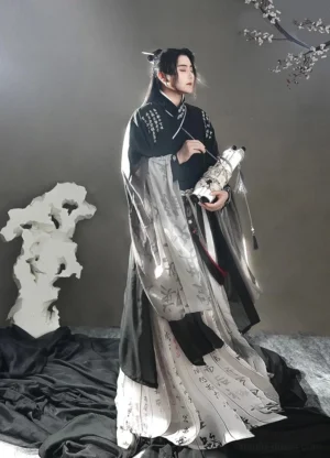 Side view of a male wuxia hanfu outfit with black cross-collar top, ink wash gradient skirt, sheer grey sleeves, and Chinese handwritten calligraphy