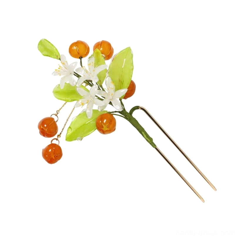 Mandarin orange Chinese hair stick displayed on a white background with gold-tone double-pronged base green leaves white flowers and round orange pendants