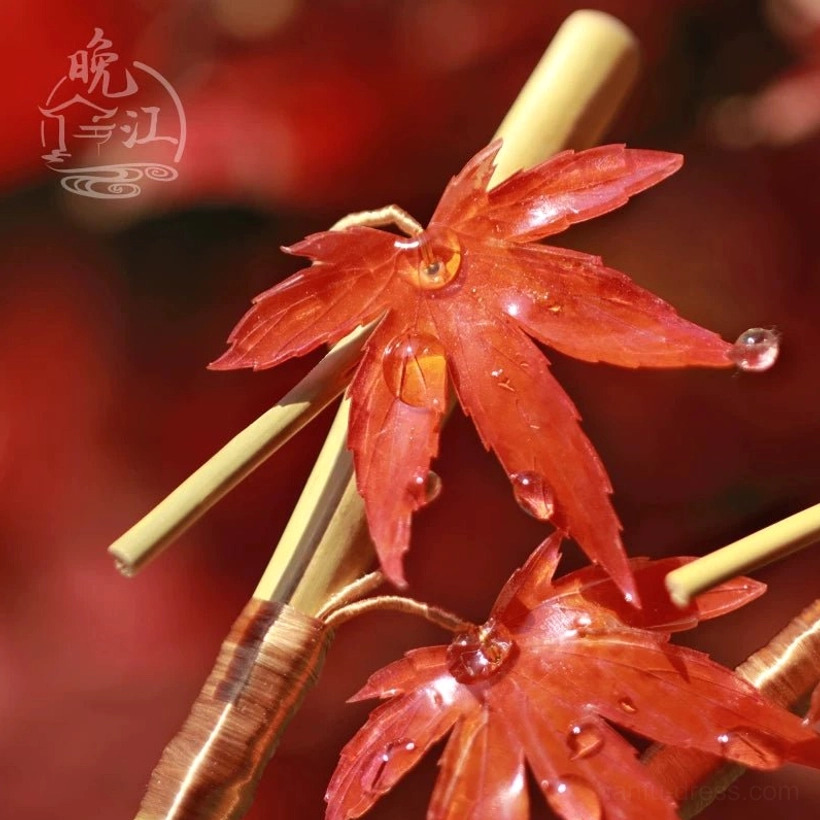 Close-up maple leaf hair stick showing detailed leaf veins, wooden base, and translucent resin dewdrop accents