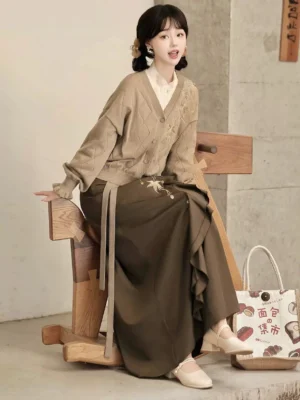 Maple Pavilion modern Hanfu autumn outfit with cream top taupe cardigan dark brown embroidered skirt and maple leaf details