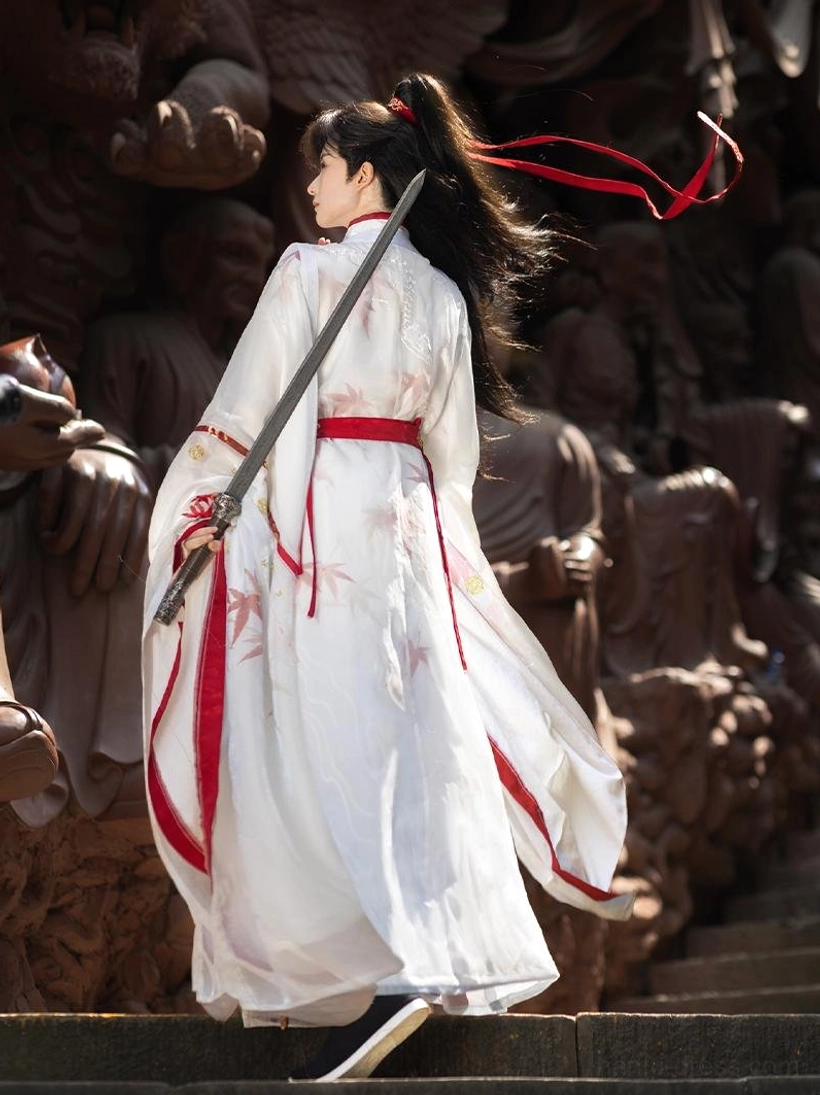 Back side view of Maple Snow men hanfu robe with flowing hem red maple embroidery and red hair ribbon