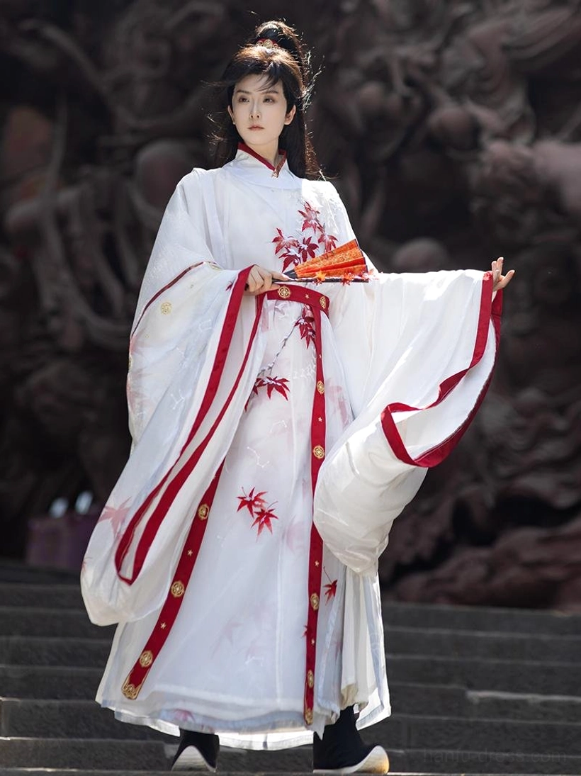 Side view of white and red Maple Snow Song Dynasty hanfu for men with flowing sleeve and red folding fan