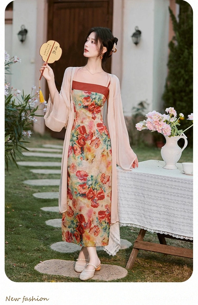 Full view of Marigold floral modern Hanfu slip dress and sheer cardigan complete set styled with a round tassel fan