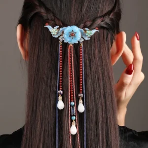 Blue floral Hanfu back hair pin worn on a half-braided hairstyle with long red and blue bead tassels and white jade-look pendants