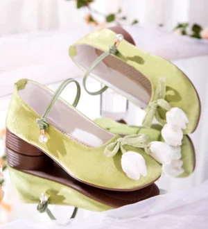 Matcha green tulip Hanfu block heel Chinese shoes with white floral bows, pearl ankle strap accents, woven insoles, and brown rubber heels