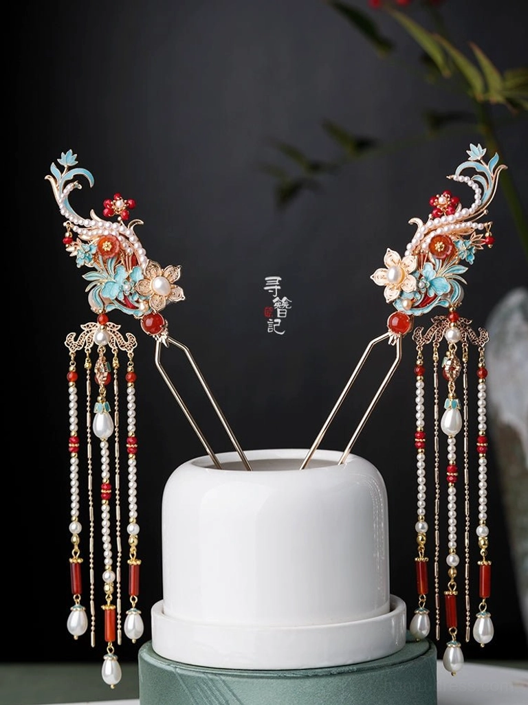 Matching pair of Chinese hanfu phoenix tassel hairpins shown from an alternate angle with turquoise floral motifs, red and white accents, long tassels, and pearl pendants
