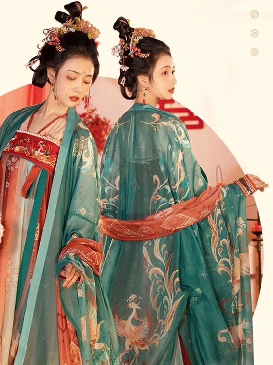 Two models wearing matching Tang Dynasty wedding hanfu layers with emerald embroidered outer robes red bridal panels wide sleeves and flowing skirts