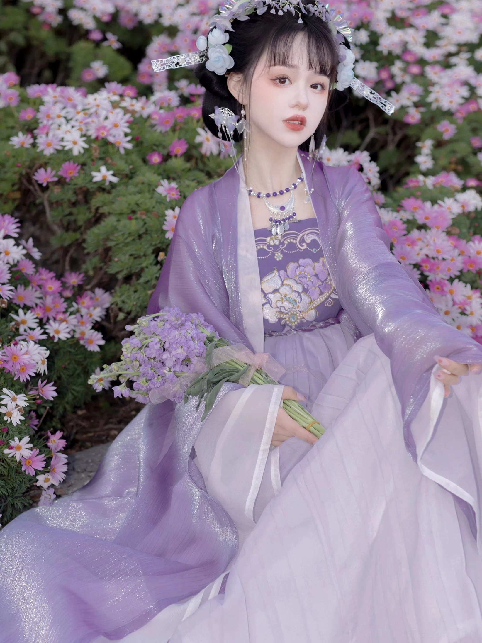 Mauve Tang Dynasty Hanfu Heziqun dress seated front three-quarter view with embroidered floral bodice and wide flowing sleeves