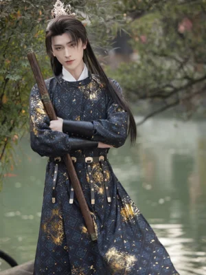 Blue men’s Tang Dynasty Hanfu robe with gold cloud print shown full length in a wuxia swordsman-inspired outdoor setting