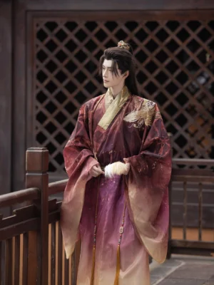 Men's dragon embroidery hanfu robe shown from a three-quarter side view, featuring a purple burgundy ombre gradient, golden cross-collar trim, flowing sleeves, and waist tassel detail