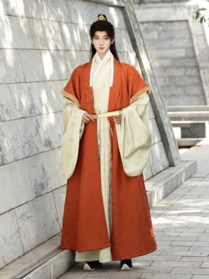 Full front view of men’s orange and cream layered Ming Dynasty Hanfu winter robe set with wide sleeves and long flowing silhouette