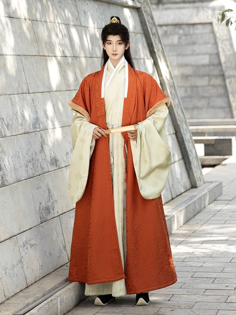 Full front view of men’s orange and cream layered Ming Dynasty Hanfu winter robe set with wide sleeves and long flowing silhouette