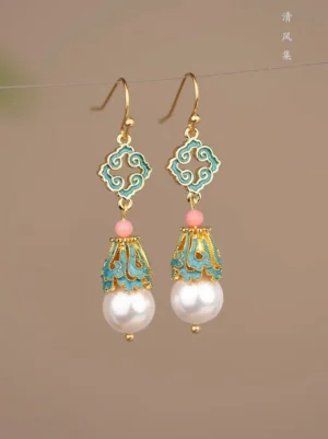 Front close-up of Chinese retro cloud motif cloisonne style pearl drop earrings with blue and pink enamel details for Hanfu