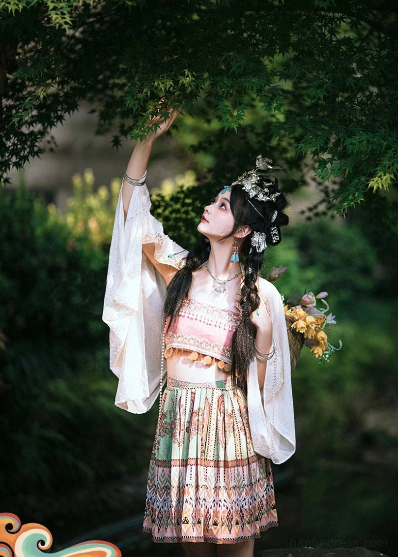 Miao inspired modern Hanfu fashion look with wide sleeve embroidered coat pink cropped camisole silver jewelry and garden styling