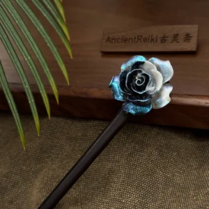Close-up of glittery midnight blue and milky white layered rose ornament on a traditional Chinese hair stick for Hanfu updos