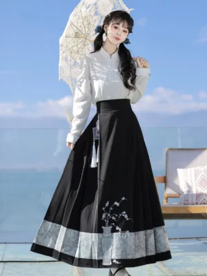 Full body view of Ming-inspired Hanfu set with white stand collar top ruffled shawl embroidered mamianqun and lace parasol