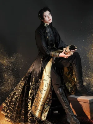 Three-quarter seated view of the Midnight Sun modern Hanfu outfit featuring a black stand-collar top, gold patterned horse-face skirt, slim black pants, and leather boots