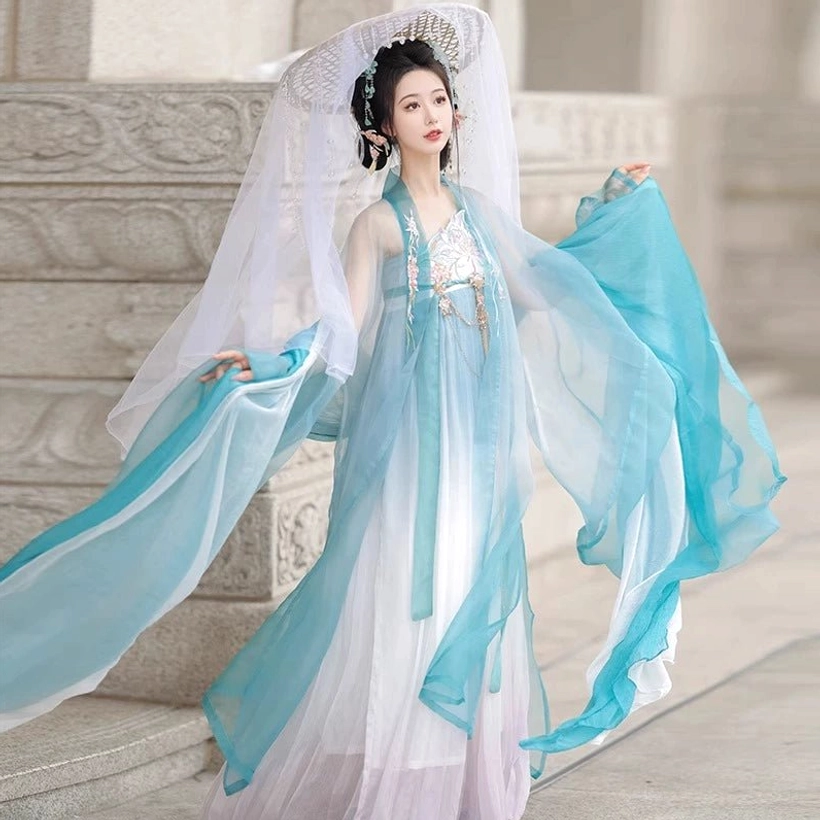 Side view of blue Tang Dynasty Hanfu Heziqun complete set with ultra flowing sheer sleeves, blue white gradient dress and tassel bodice