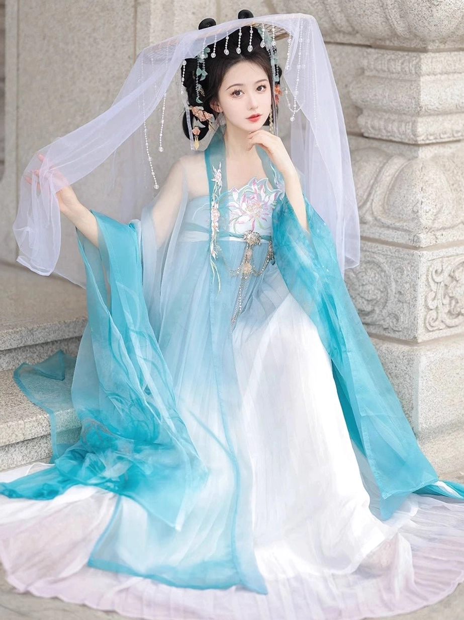 Blue Tang Dynasty Hanfu Heziqun dress set with white gradient skirt, translucent wide sleeve coat, floral bodice and long flowing sash