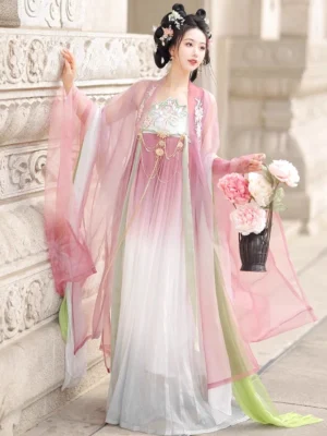Pink Tang style Heziqun Hanfu dress with sheer outer robe, floral chest decoration, tassels and peony basket in stone courtyard setting