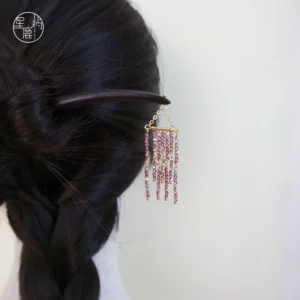 Purple Milky Way beaded tassel traditional Chinese hair stick worn in a braided dark hair updo