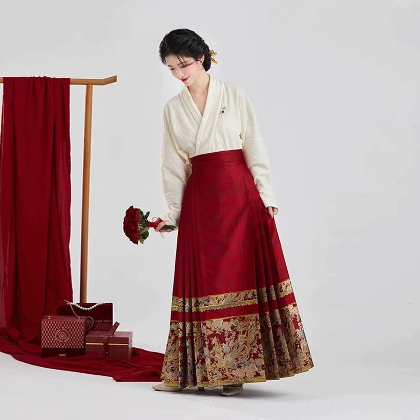 Ming Dynasty inspired bridal Hanfu tea ceremony outfit shown in side view with ivory cross-collar top and wine-red gold brocade mamian skirt