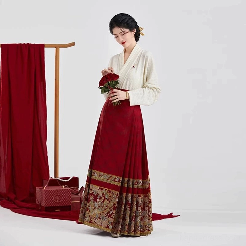 Full length Ming Dynasty inspired Chinese bridal Hanfu with ivory cross-collar top wine-red mamian skirt and ornate gold floral animal motifs