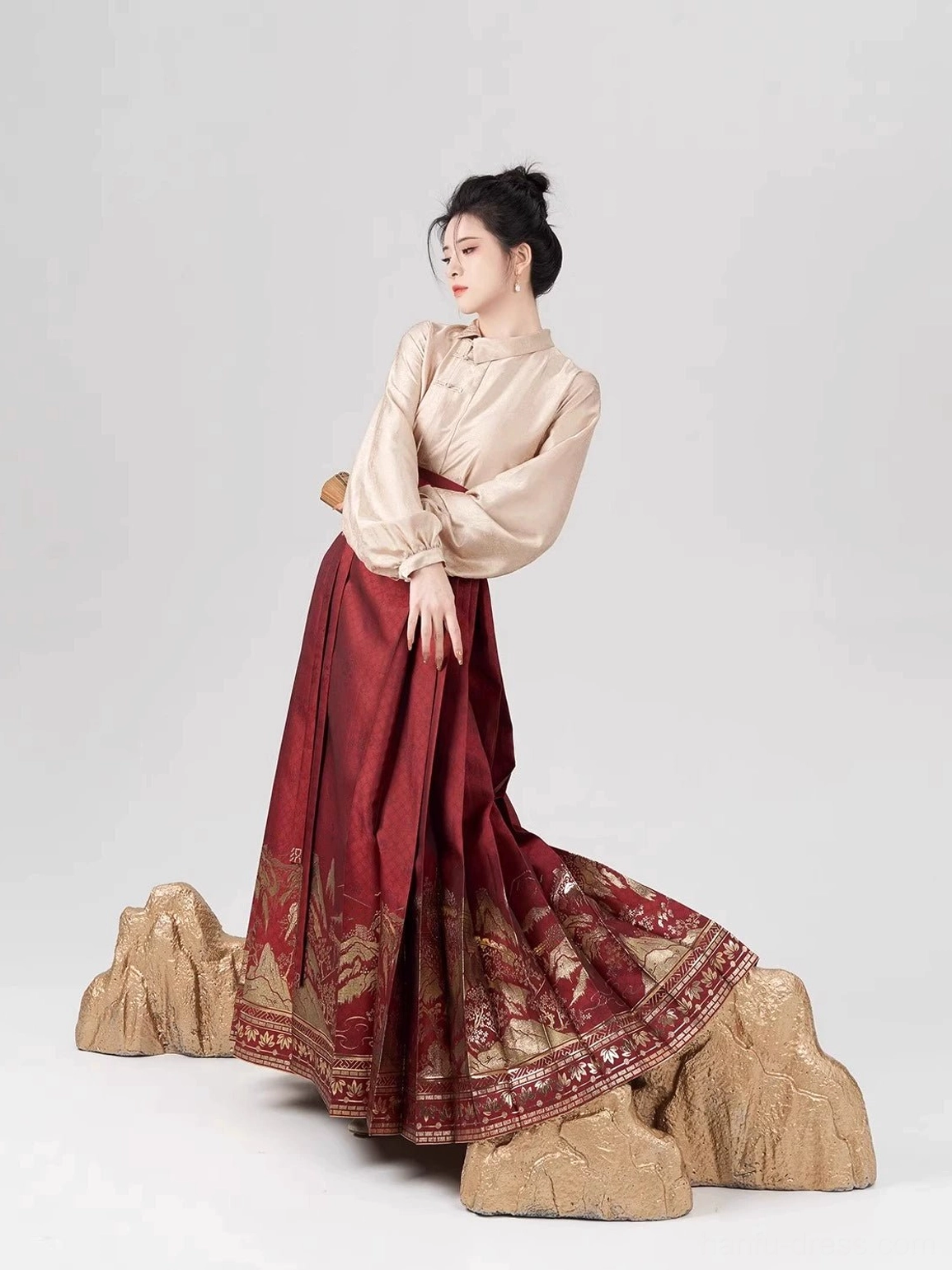 Ming Dynasty inspired Chinese New Year hanfu full set with champagne apricot stand-collar top and wine-red landscape mamian skirt side view