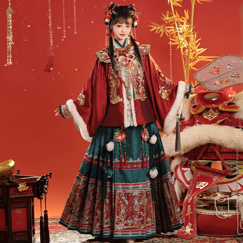 Full Ming Dynasty inspired Chinese New Year Hanfu set featuring embroidered red pipa sleeve top, cloud collar, and dark green mamian skirt