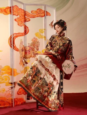 Ming dynasty Chinese New Year Hanfu set shown from a low three-quarter side view with red and gold embroidered top ivory mamian skirt cloud collar and round silk fan