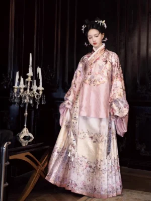 Full body view of a dusty pink Ming Dynasty floral hanfu set with pipa sleeve top and cream mamian skirt styled with traditional Chinese hair ornaments