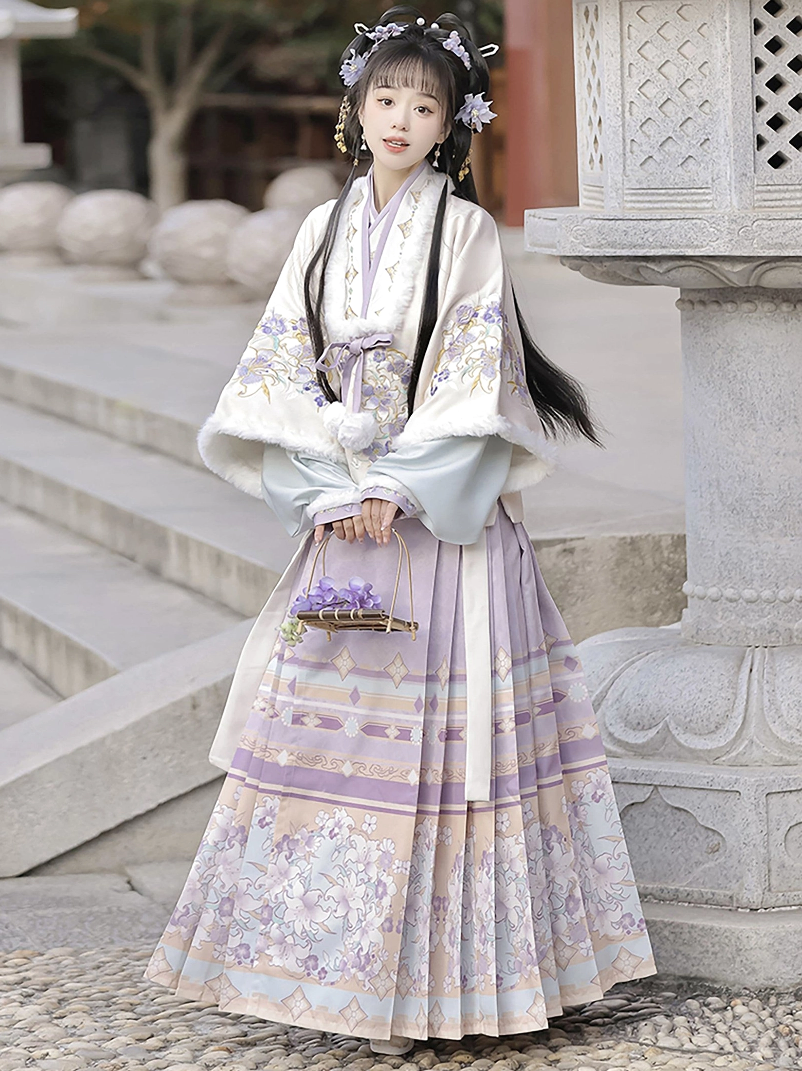 Front view of Ming Dynasty Hanfu showing cream cross-collar jacket and lavender pleated Mamian skirt with printed borders