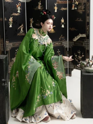 Ming Dynasty Hanfu floral embroidered robe with off-white mamian skirt and traditional Chinese hairstyle side seated view