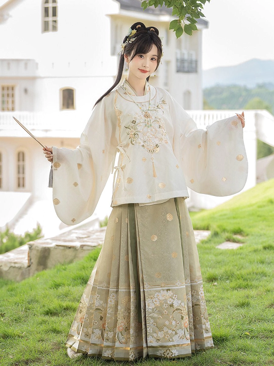 Ming Dynasty Hanfu outfit with floral embroidered Mamian skirt hem and folding fan in an outdoor villa setting